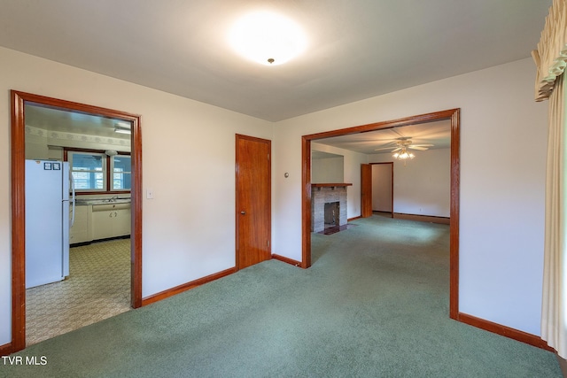 173 Keller Ln, Marion, VA 24354 - carpeted empty room featuring baseboards, a fireplace, a ceiling fan, and a sink