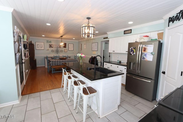 21164 Vances Mill Rd, Abingdon, VA 24211 - kitchen with stainless steel refrigerator with ice dispenser, recessed lighting, crown molding, a sink, and dark countertops