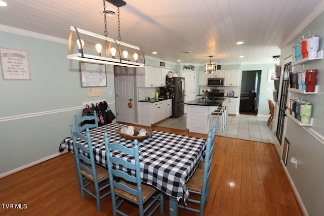 21164 Vances Mill Rd, Abingdon, VA 24211 - dining room with recessed lighting, light wood-style flooring, baseboards, wood ceiling, and crown molding