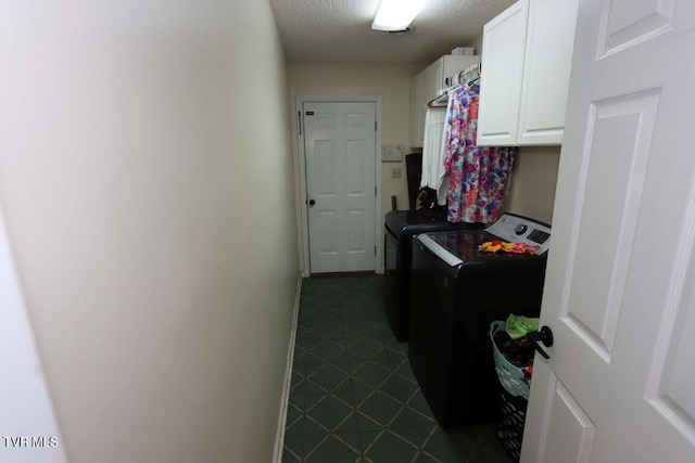 21164 Vances Mill Rd, Abingdon, VA 24211 - laundry area featuring washer and clothes dryer, cabinet space, and a textured ceiling