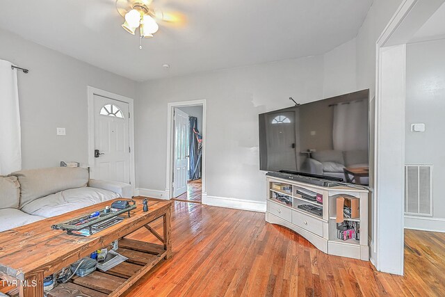 218 W Banner St, Lebanon, VA 24266 - living room with hardwood / wood-style floors, ceiling fan, and baseboards