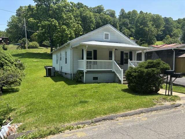 181 Powerhouse Holw, Clintwood, VA 24228 - view of front of property with a porch, a front yard, and central AC