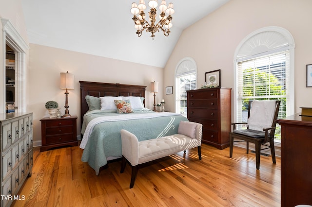 404 E Mountain View Rd Unit 204, Johnson City, TN 37601 - bedroom with light wood-style floors, vaulted ceiling, and a chandelier