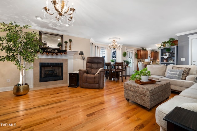 404 E Mountain View Rd Unit 204, Johnson City, TN 37601 - living area with a chandelier, ornamental molding, light wood-type flooring, and a tile fireplace