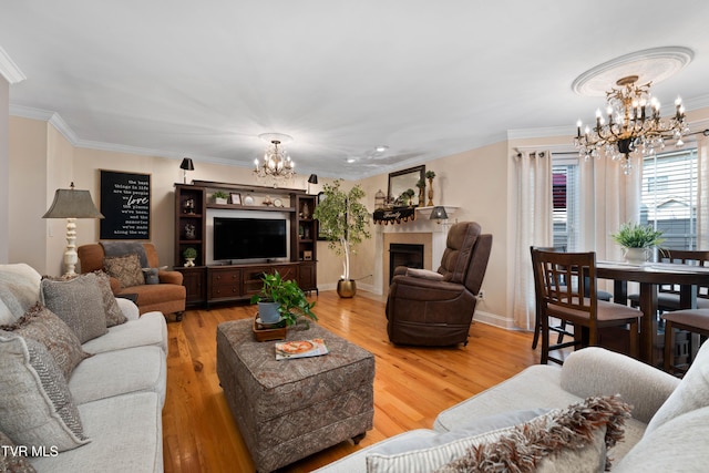 404 E Mountain View Rd Unit 204, Johnson City, TN 37601 - living room featuring a chandelier, crown molding, wood finished floors, baseboards, and a fireplace