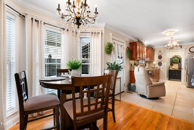 404 E Mountain View Rd Unit 204, Johnson City, TN 37601 - dining space featuring a chandelier, crown molding, light tile patterned flooring, and baseboards