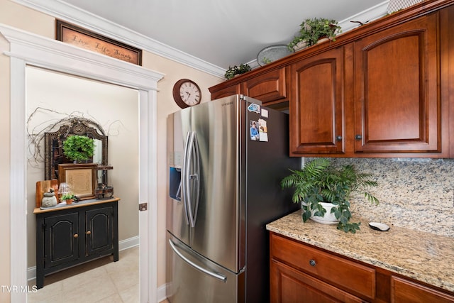 404 E Mountain View Rd Unit 204, Johnson City, TN 37601 - kitchen with stainless steel refrigerator with ice dispenser, light stone countertops, baseboards, tasteful backsplash, and crown molding