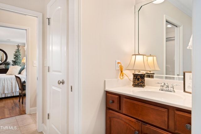 404 E Mountain View Rd Unit 204, Johnson City, TN 37601 - bathroom with vanity, crown molding, tile patterned flooring, and connected bathroom