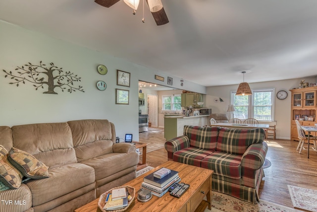 240 Watson Rd, Bristol, TN 37620 - living room featuring ceiling fan, light wood-style floors, and baseboards