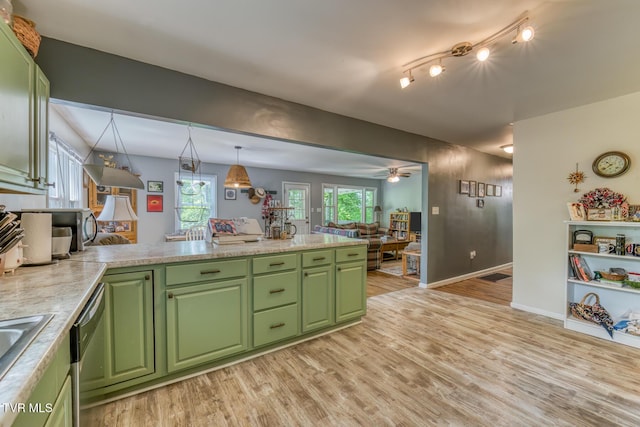 240 Watson Rd, Bristol, TN 37620 - kitchen with green cabinetry, light wood-type flooring, light countertops, dishwasher, and baseboards