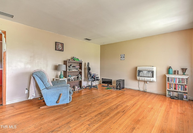 509 9th St, Erwin, TN 37650 - living area with heating unit, wood finished floors, and baseboards