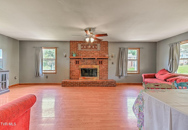 509 9th St, Erwin, TN 37650 - living area featuring plenty of natural light, a ceiling fan, baseboards, and light wood-type flooring