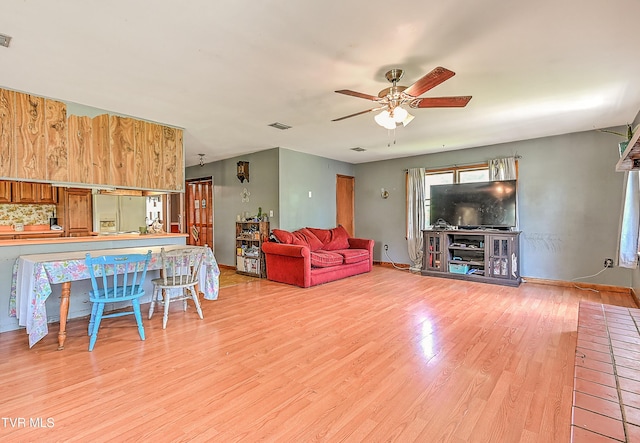 509 9th St, Erwin, TN 37650 - living area with ceiling fan, wood finished floors, and baseboards