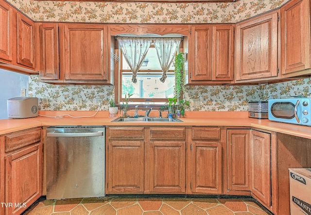 509 9th St, Erwin, TN 37650 - kitchen featuring stainless steel dishwasher, light countertops, brown cabinetry, and a sink