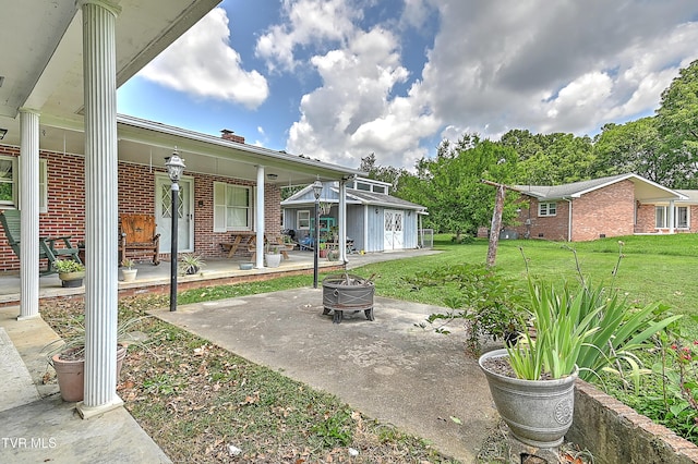 509 9th St, Erwin, TN 37650 - porch featuring an outdoor fire pit, a lawn, and an outdoor structure