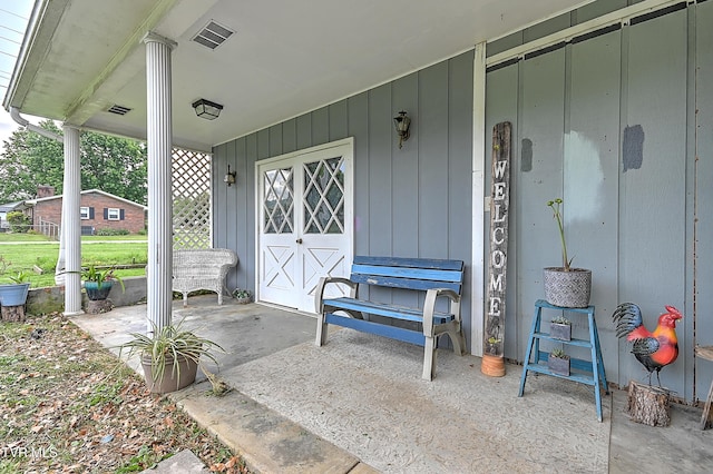 509 9th St, Erwin, TN 37650 - view of exterior entry with covered porch and board and batten siding