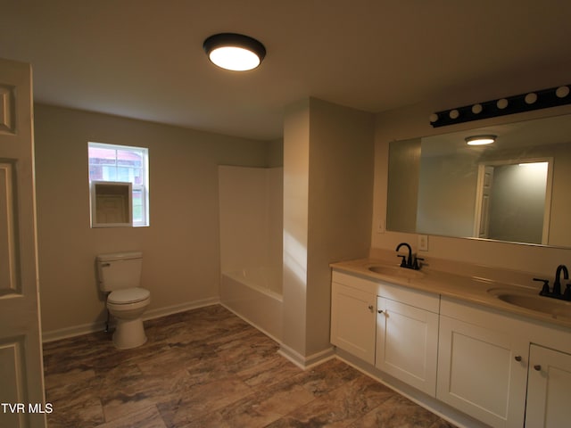 321 W Chilhowie Ave, Johnson City, TN 37604 - bathroom featuring double vanity, toilet, and baseboards