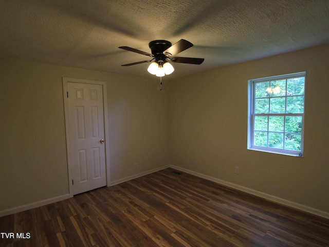 321 W Chilhowie Ave, Johnson City, TN 37604 - spare room with dark wood-style flooring, baseboards, a ceiling fan, and a textured ceiling