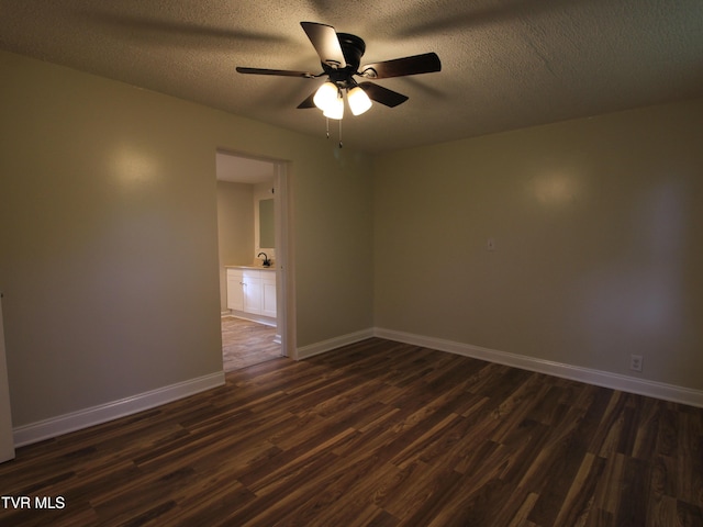 321 W Chilhowie Ave, Johnson City, TN 37604 - spare room with dark wood-style floors, ceiling fan, baseboards, and a textured ceiling