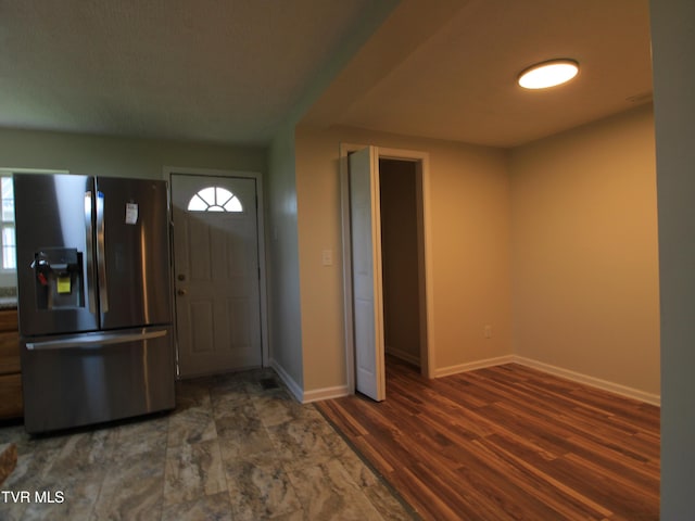 321 W Chilhowie Ave, Johnson City, TN 37604 - entryway with baseboards, healthy amount of natural light, and wood finished floors