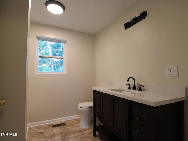321 W Chilhowie Ave, Johnson City, TN 37604 - bathroom with toilet, baseboards, vanity, and stone finish floors