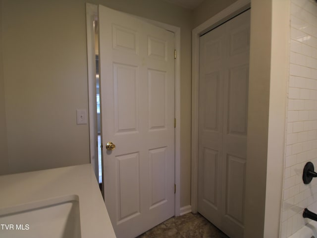 321 W Chilhowie Ave, Johnson City, TN 37604 - bathroom with washtub / shower combination and a sink