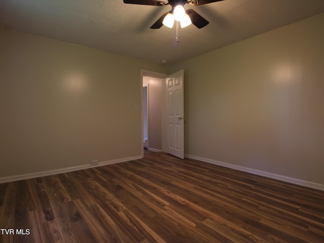 321 W Chilhowie Ave, Johnson City, TN 37604 - unfurnished room with dark wood-style flooring, baseboards, and ceiling fan