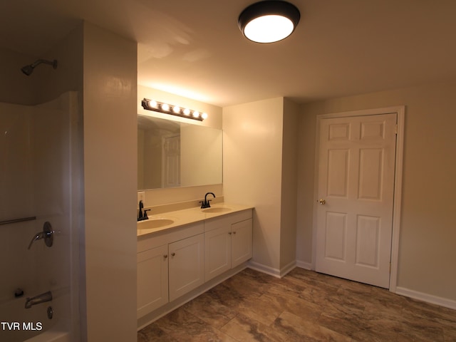 321 W Chilhowie Ave, Johnson City, TN 37604 - bathroom featuring double vanity, bathtub / shower combination, and baseboards