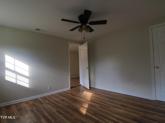 321 W Chilhowie Ave, Johnson City, TN 37604 - unfurnished room with baseboards, dark wood finished floors, and a ceiling fan