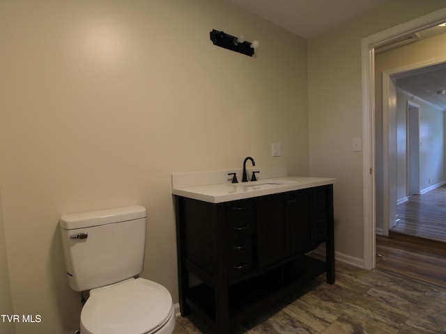 321 W Chilhowie Ave, Johnson City, TN 37604 - half bathroom featuring vanity, toilet, wood finished floors, and baseboards
