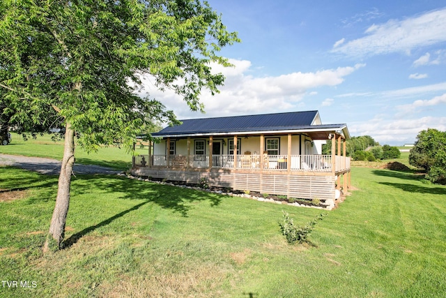 114 Adam And Corby Rd, Limestone, TN 37681 - farmhouse-style home with a porch, a front yard, and a metal roof