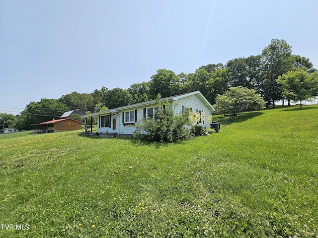 515 Chuckey Pike, Chuckey, TN 37641 - view of side of property featuring a lawn