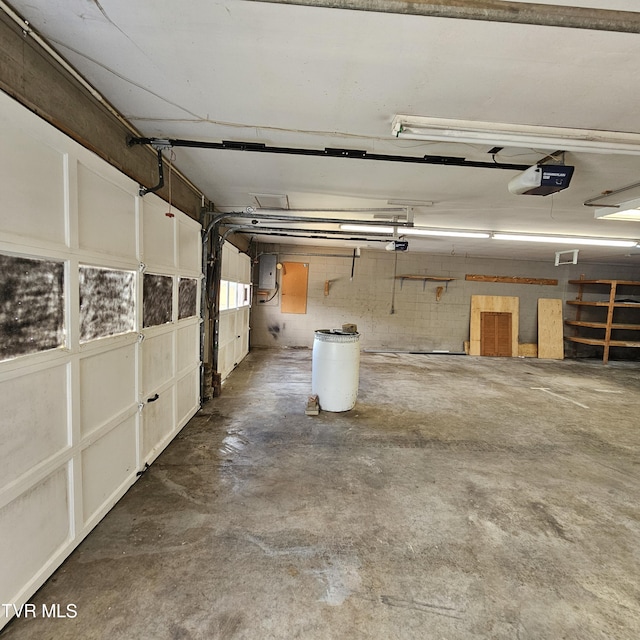 515 Chuckey Pike, Chuckey, TN 37641 - garage featuring a garage door opener and electric panel