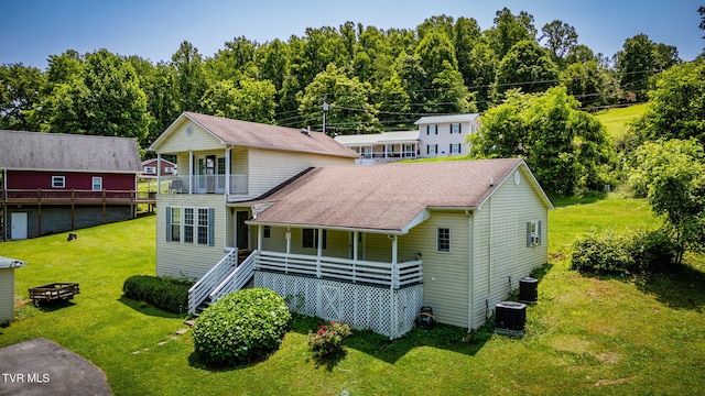 23270 Denton Valley Rd, Abingdon, VA 24211 - view of front of house featuring central air condition unit, a front yard, covered porch, and an outdoor fire pit