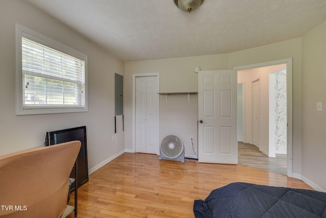 23270 Denton Valley Rd, Abingdon, VA 24211 - bedroom with electric panel, light wood finished floors, baseboards, and a closet