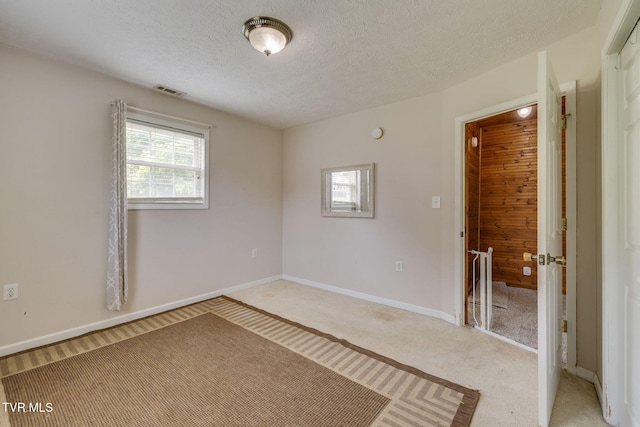 23270 Denton Valley Rd, Abingdon, VA 24211 - spare room featuring light colored carpet, a textured ceiling, and baseboards