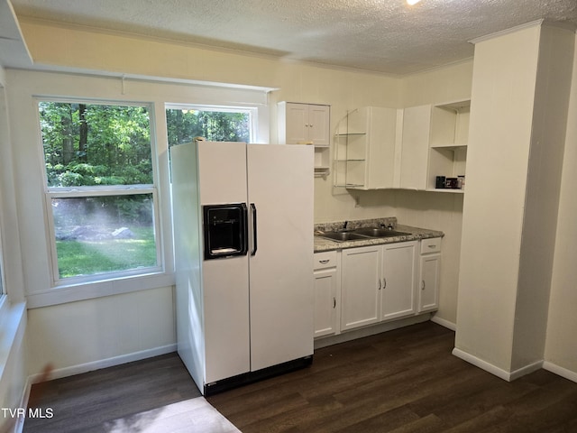 1510 Rock Creek Rd, Erwin, TN 37650 - kitchen with white fridge with ice dispenser, open shelves, a textured ceiling, plenty of natural light, and dark wood finished floors