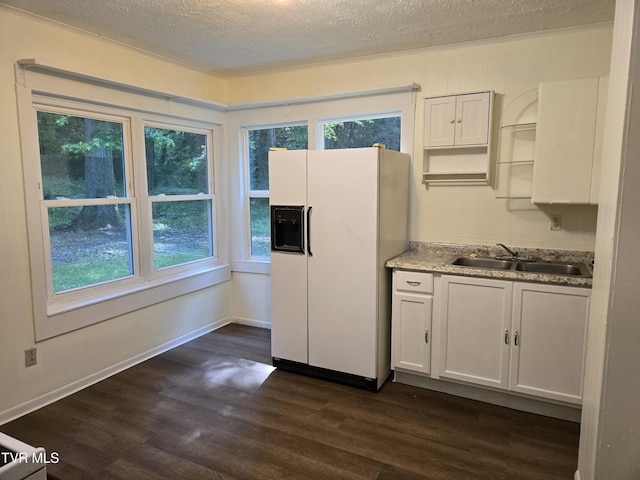 1510 Rock Creek Rd, Erwin, TN 37650 - kitchen with a sink, white fridge with ice dispenser, a textured ceiling, dark wood-style floors, and white cabinetry