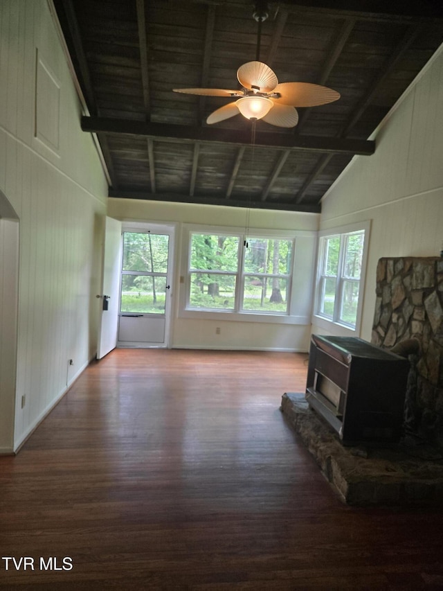 1510 Rock Creek Rd, Erwin, TN 37650 - living area featuring wood finished floors, a wood stove, a ceiling fan, high vaulted ceiling, and wooden ceiling with exposed beams