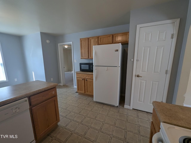 18408 Fortunes Way, Abingdon, VA 24210 - kitchen featuring white appliances, light flooring, and brown cabinetry