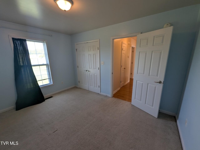18408 Fortunes Way, Abingdon, VA 24210 - unfurnished bedroom featuring light colored carpet and a closet