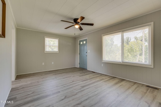 3909 Bond Dr, Kingsport, TN 37664 - spare room featuring ornamental molding, wood finished floors, and a ceiling fan