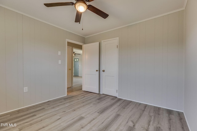 3909 Bond Dr, Kingsport, TN 37664 - empty room with a ceiling fan, light wood-type flooring, and crown molding