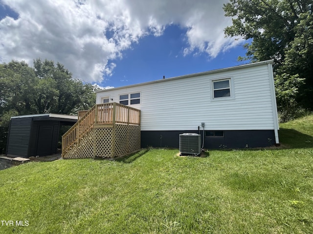 3909 Bond Dr, Kingsport, TN 37664 - back of property featuring stairway, a wooden deck, and a lawn