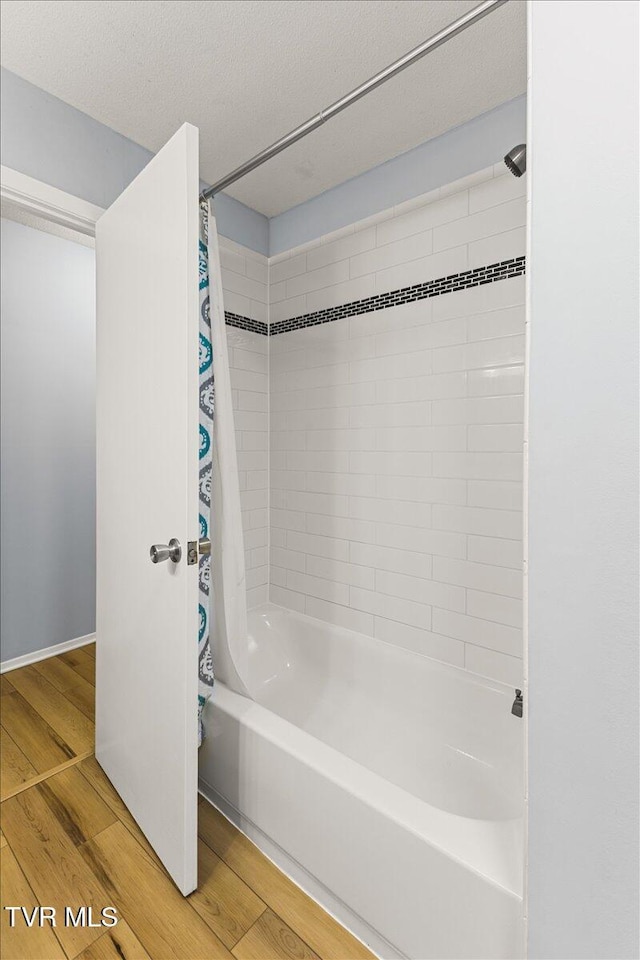 1820 Brook Hollow Rd, Johnson City, TN 37604 - full bathroom with shower / bath combo with shower curtain and wood finished floors