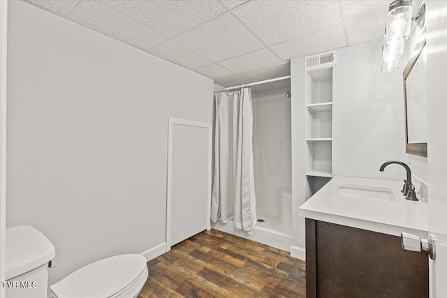 1820 Brook Hollow Rd, Johnson City, TN 37604 - full bath with toilet, a shower with shower curtain, vanity, a drop ceiling, and wood finished floors