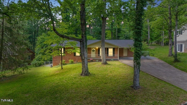 1820 Brook Hollow Rd, Johnson City, TN 37604 - view of front facade with concrete driveway, covered porch, and a front lawn