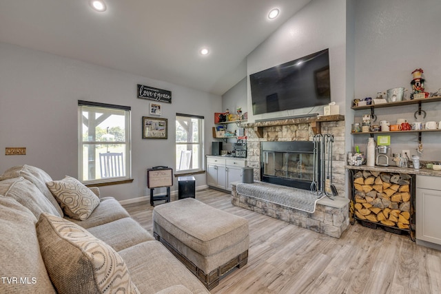 325 Barren Rd, Chuckey, TN 37641 - living room with a stone fireplace, high vaulted ceiling, light wood-style flooring, recessed lighting, and baseboards