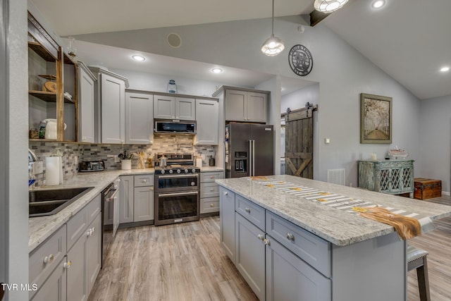 325 Barren Rd, Chuckey, TN 37641 - kitchen featuring appliances with stainless steel finishes, gray cabinets, light wood-style flooring, backsplash, and high vaulted ceiling