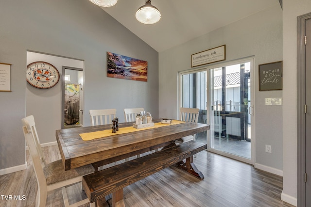 325 Barren Rd, Chuckey, TN 37641 - dining room featuring wood finished floors, baseboards, and high vaulted ceiling